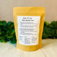 Herbal tea package with usage instructions on a neutral background